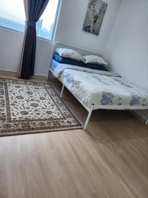 a bedroom with a bed and a rug and a window at SCANDI HOMESTAY IPOH muslem in Ipoh