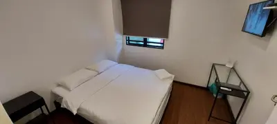 a small bedroom with a white bed and a window at Olive Bedz Hotel in Tambun