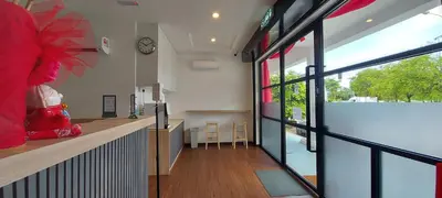 a lobby of a store with a clock on the wall at Olive Bedz Hotel in Tambun