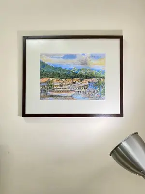 a picture of a painting hanging on a wall at Spacious cozy Lakeville homestay 4 bedrooms all with AirCond in Seri Iskandar