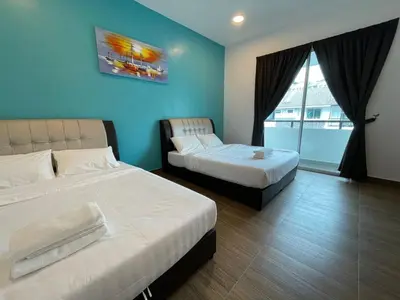 a hotel room with two beds and a window at Golden Hill Home by Dreamscape in Cameron Highlands