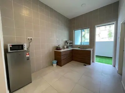 a kitchen with a refrigerator and a sink and a window at Golden Hill Home by Dreamscape in Cameron Highlands