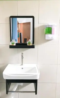 a white sink in a bathroom with a mirror at Teratak Ar-Rayyan x Villa Abi in Batu Kurau