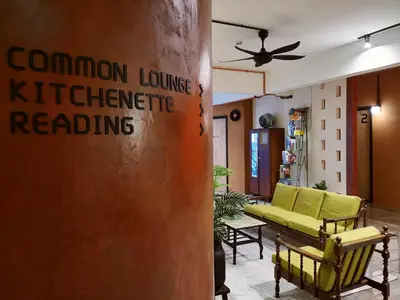 a lobby with a sign that reads common loungeknife reading at Walk-Up To SIAR - Children Not Allowed in Cameron Highlands