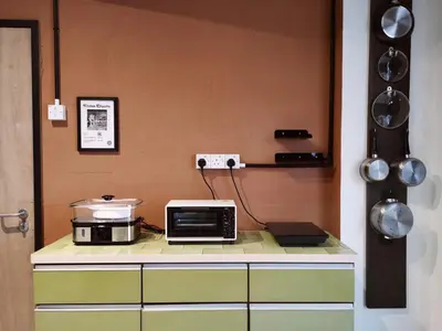 a kitchen with a microwave and a toaster oven on a counter at Walk-Up To SIAR - Children Not Allowed in Cameron Highlands