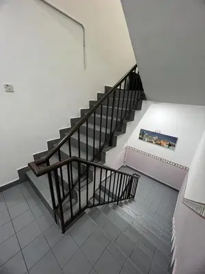 a staircase in a building with a stair case at Hotel Rasa Sayang 2 in Tanah Rata