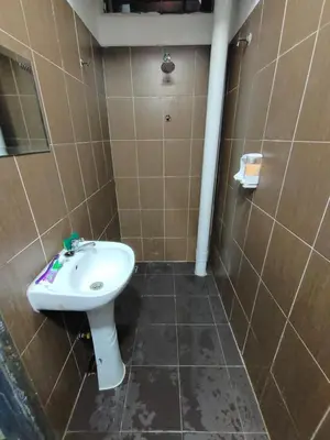 a bathroom with a toilet and a sink in it at Alish Homestay Gua Musang with Free WiFi, Netflix in Gua Musang