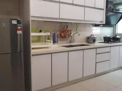 a kitchen with white cabinets and a stainless steel refrigerator at W13 atGoldenHills NightMarket WiFi 4R in Brinchang