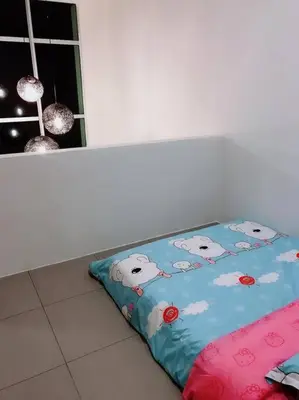a bed sitting on the floor next to a window at W5WarmStay@Golden Hill/Penthouse/WiFi/3R/NightMarket/2CarPark in Brinchang