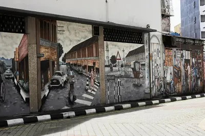 a building with paintings on the side of it at THE MAJESTIC IPOH B8 by ZamanJa in Ipoh