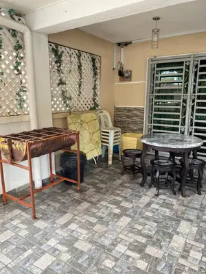 a room with two tables and a table and chairs at Azzalea Homes 5 @ Golden Hills Cameron Highlands in Brinchang