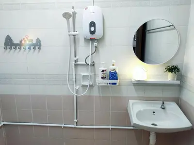 a shower in a bathroom with a sink and a mirror at Semi-Detached, Up to 21 Pax, 4 Bedrooms, 3 Bathrooms, 4 Car Parks by Star Home in Bayan Lepas