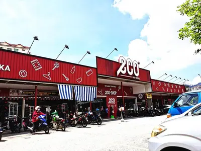 a group of motorcycles parked in front of buildings at TuR11-Oppesite Pisa Stadium-1min-FoodCourt-MiniMarket in Bayan Lepas
