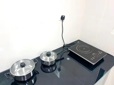 two pots and pans on a stove in a kitchen at ●SSV10●4pax●Comfort House●13minit●Airpot●CondoPool in Bayan Lepas
