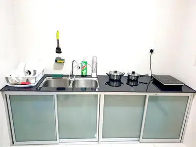 a kitchen counter with a sink and a stove at ●SSV10●4pax●Comfort House●13minit●Airpot●CondoPool in Bayan Lepas