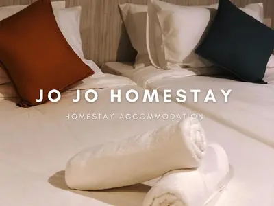 a close up of a bed with a towel on it at Jo Jo Homestay @ Marina Island Laguna in Lumut