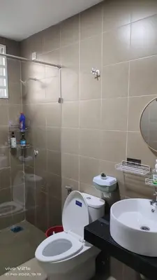 a bathroom with a toilet and a sink and a shower at Mysa Homestay in Kampong Batu Dua