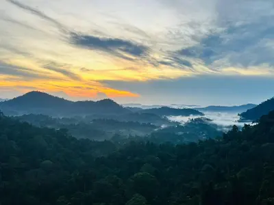 view of a valley with forests and mountains at Nova Sunrise n Mountain view Hilltop Hotel apartment in Nova Cameron Highlands in Brinchang