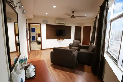 a living room with a couch and a tv at My Hotel Bukit Mertajam in Bukit Mertajam