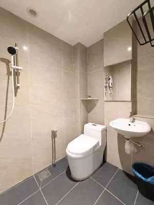 a bathroom with a toilet and a sink at Pangkor Pop Ash Hotel in Pangkor