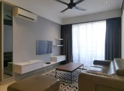 a living room with a couch and a tv at New Ipoh The Majestic Condo Homestay in Ipoh