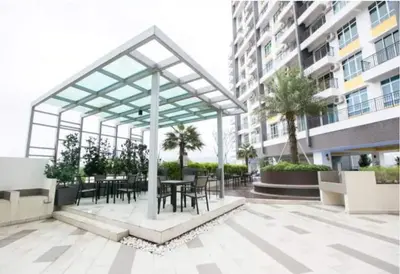 a patio with tables and chairs in a building at New Ipoh The Majestic Condo Homestay in Ipoh