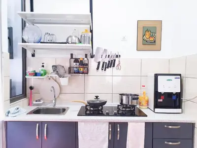 a small kitchen with a sink and a stove at Mossy Forest Family Retreat, Kea Farm Brinchang in Brinchang
