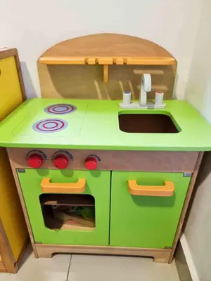 a toy kitchen with a stove and a sink at Mossy Forest Family Retreat, Kea Farm Brinchang in Brinchang