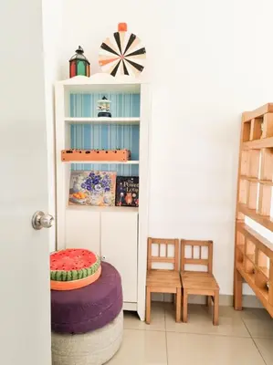a room with a white book shelf and a stool at Mossy Forest Family Retreat, Kea Farm Brinchang in Brinchang