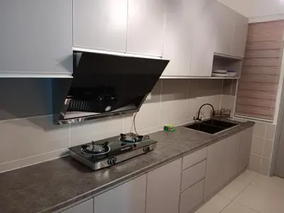 a kitchen with a stove and a sink at Muslim Apartment at Meru in Ipoh