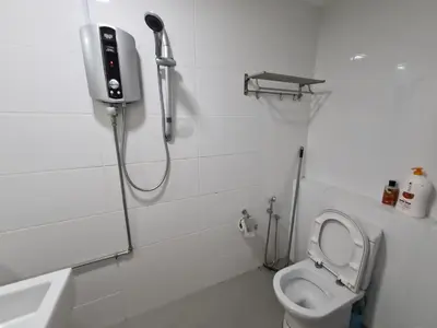 a bathroom with a shower and a toilet and a sink at Sunrise Gurney Premium Executive City/Seafront suite - Penang in George Town