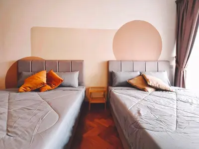 two beds sitting next to each other in a room at THE LANDMARK BY KATANA New 3BR Grand Seaview Homestay at Gurney \u65e0\u654c\u6d77\u666f\u4e09\u623f\u5957\u623f in Tanjung Bungah