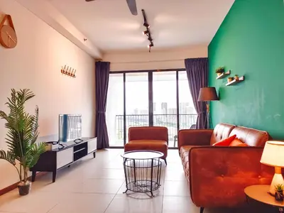 a living room with a couch and a tv at THE LANDMARK BY KATANA New 3BR Grand Seaview Homestay at Gurney \u65e0\u654c\u6d77\u666f\u4e09\u623f\u5957\u623f in Tanjung Bungah