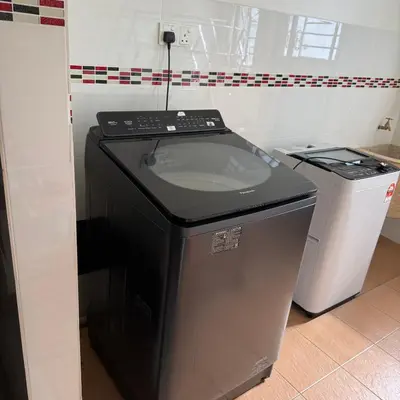 a washing machine sitting next to a trash can at 50PAX 9BR Villa Kids Swimming Pool, KTV, BBQ n Pool Tables near SPICE Arena Penang 9800 SQFT in Bayan Lepas