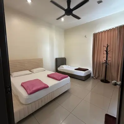 a bedroom with two beds and a ceiling fan at 18PAX 4BR Villa with Kids Swimming Pool, KTV, BBQ near SPICE Arena Penang in Bayan Lepas