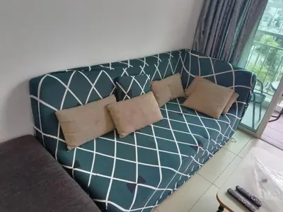 a couch with two pillows on it in a living room at Cameron 3room Golden Hills in Brinchang