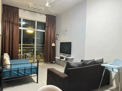 a living room with a couch and a tv at #CameronHighlands homestay in Brinchang