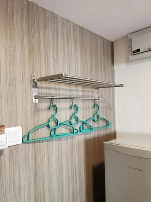 a bunch of green metal hangers in a bathroom at C 13 Lot 10 Pangkor Leisure Beach Studio in Pangkor
