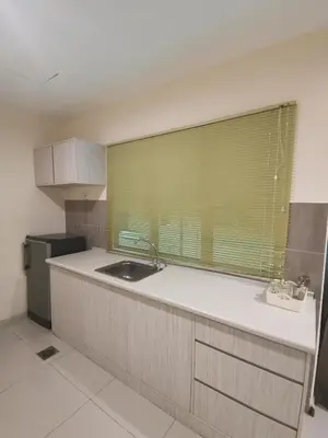 a kitchen with a sink and a window in it at Rustic one bedroom unit for 4pax by Jomy Management in Lumut