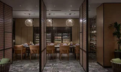 a dining room with a table and chairs at Amari SPICE Penang in Bayan Lepas