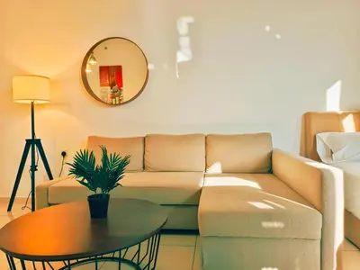 a living room with a couch and a table at Bali-style 2Bedroom Beacon Georgetown WL in George Town