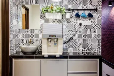 a bathroom with a counter with a mixer and a sink at Surprised Homestay Butterworth in Butterworth
