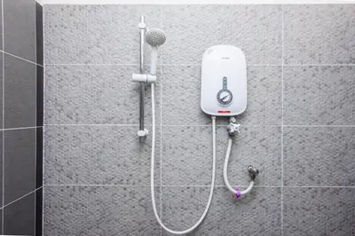 a shower with a blow dryer on a wall at Surprised Homestay Butterworth in Butterworth