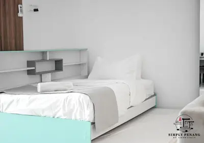 a white bedroom with a bed and a mirror at Mansion One by Simply Penang in George Town