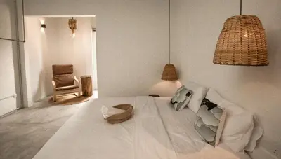 a bedroom with a bed with a pillow and a chair at Amazing Home Inn in George Town