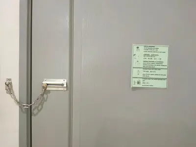a refrigerator door with a sign on it at Fong's Ipoh SImpang Pulai Homestay in Ipoh
