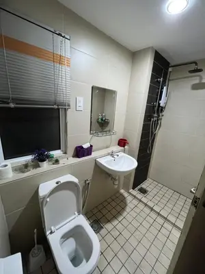 a bathroom with a toilet and a sink at Ipoh The Heyven Lakeside Homestay by Quadvanos in Ipoh