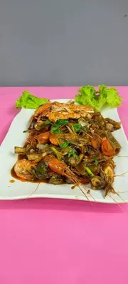 a plate of food on a pink table at BC Homestay @ Emerald Avenue Apartment, Brinchang in Brinchang