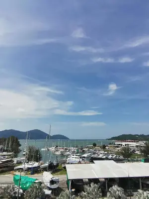 a marina with boats parked in a harbor at Peaceful 1-bedroom unit at Marina Island by JoMy Homestay in Lumut