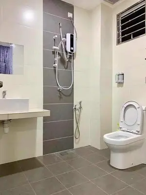 a bathroom with a shower and a toilet and a sink at Sekinchan 2008 Home：Karaoke/BBQ in Sekincan
